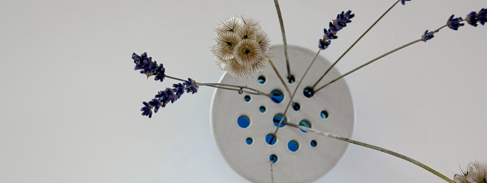 Concrete flower holder with dried flowers